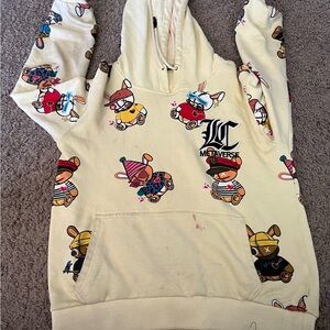 LC Metaverse Cartoon Bear Hoodie – Cream Graphic Streetwear Pullover